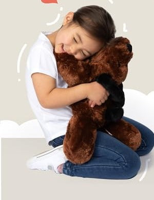 Child hugging a Cuddle Buds weighted Duke the Dog plush